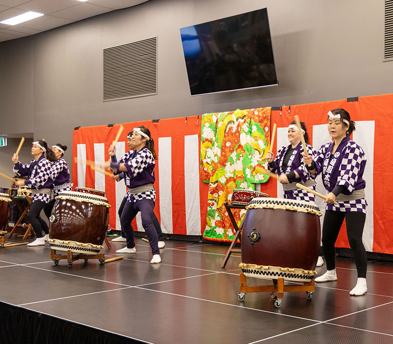Taiko drummers performing live on stage